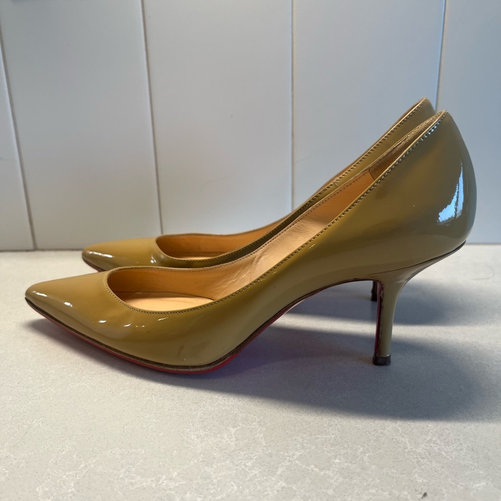 CHRISTIAN LOUBOUTIN
Pigalle Follies 55 patent-leather pumps